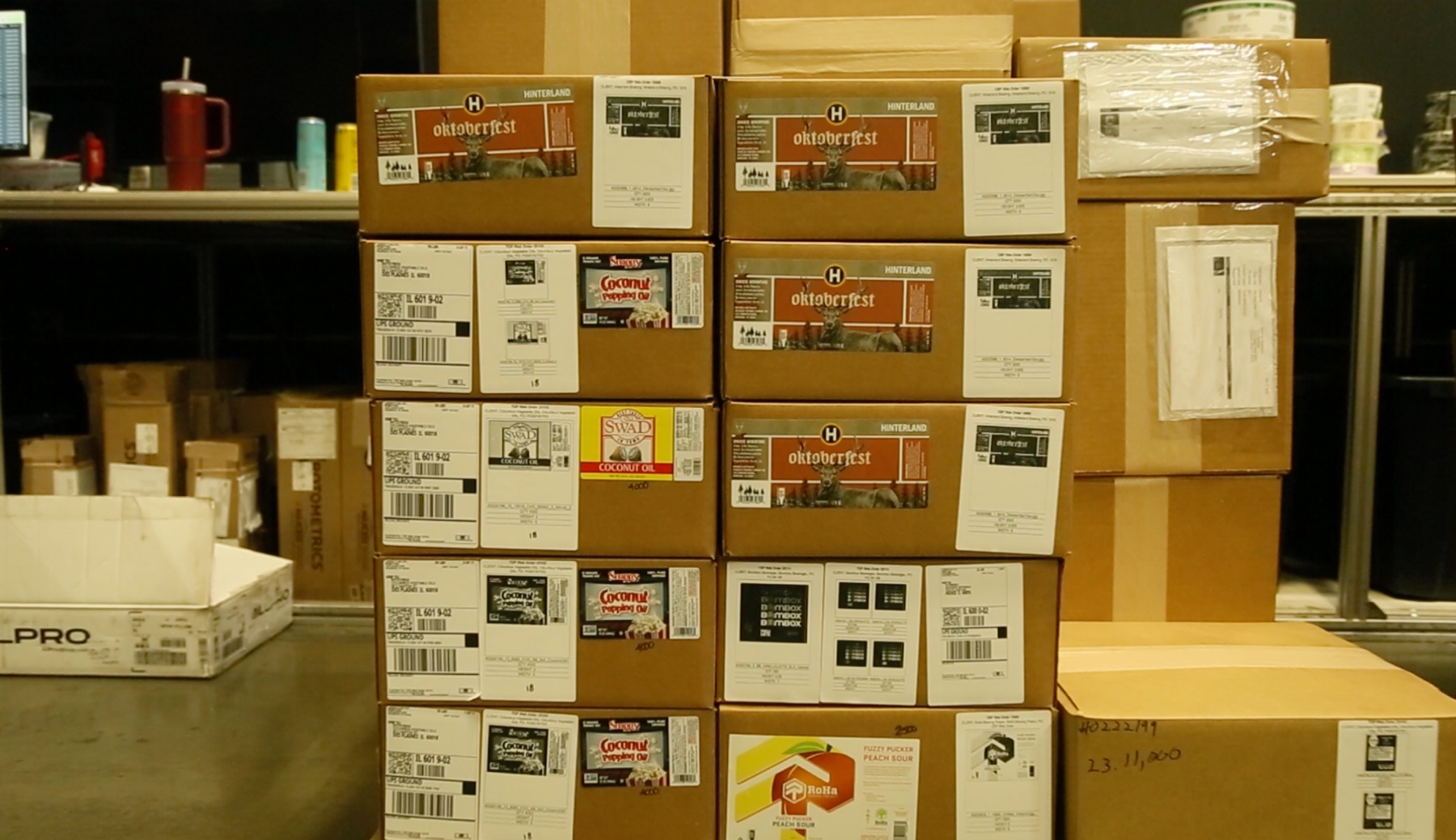 Stacked shipping boxes of finished labels for craft breweries